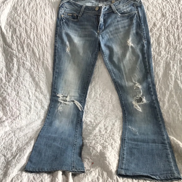 Bebe premium denim flared bottoms with rips. - Picture 2 of 4
